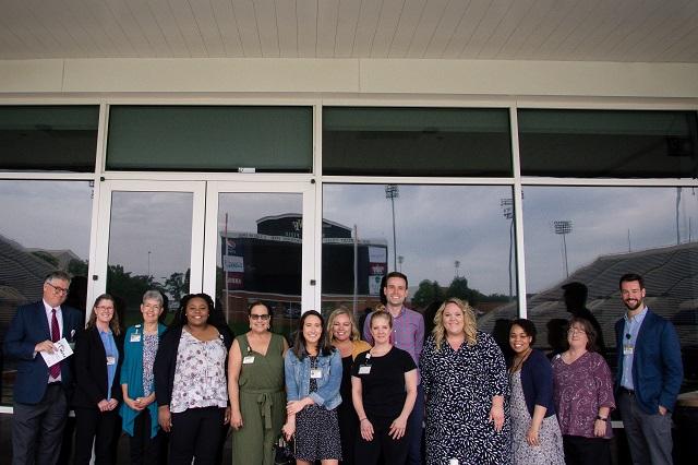 From left to right: Greg Burke, Kate Hayden, Cathy Nunn, Khadijah Winkey, Thania del Valle-Fagan, Natasha Collier, Heather Kiger, Katy Melius, Eric Fisher, Katie Tindall, Anjuna Holloman, Tim Hughes.